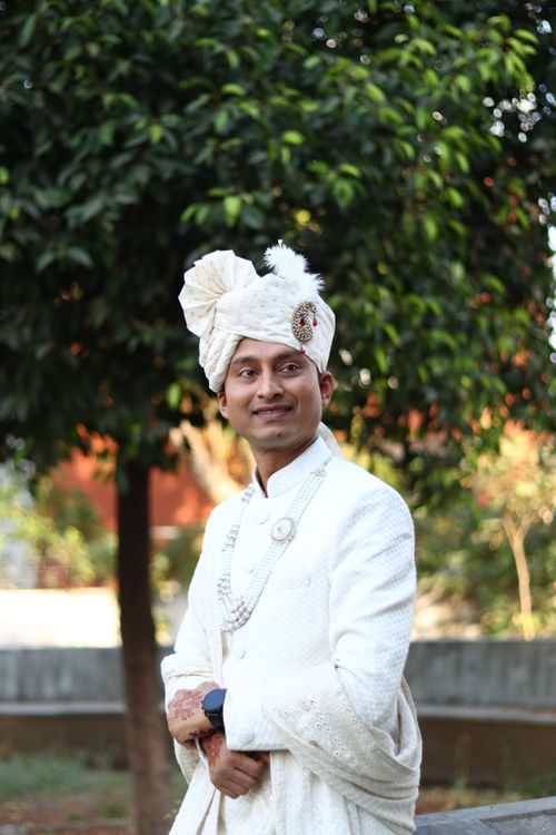 Free Man in traditional Indian clothing with turban smiling outdoors in Surat, India. Stock Photo