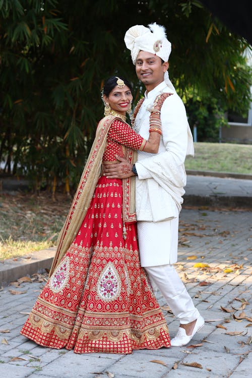 Smiling Newlyweds in Traditional Clothing 