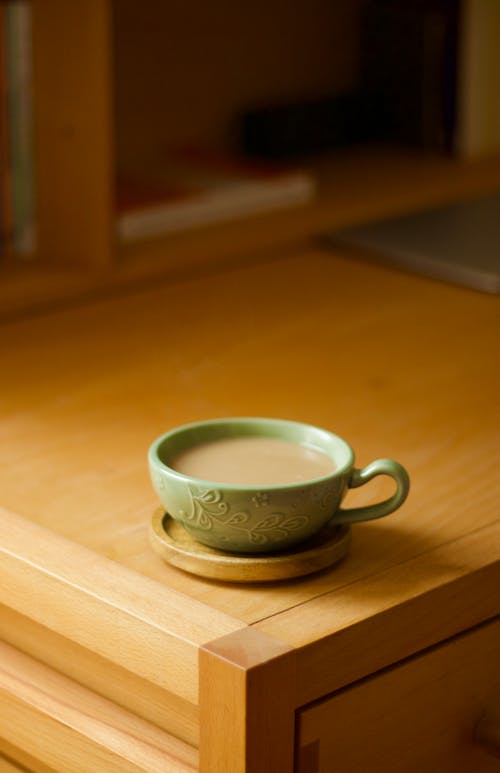 Free Cup of Coffee on the Cupboard Stock Photo