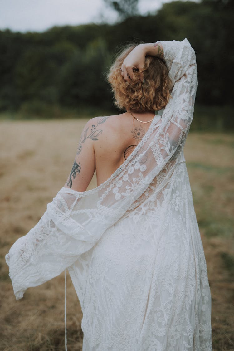 Woman Undressing White Lace Sundress