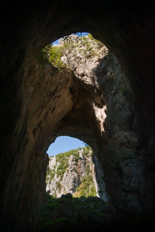 View from the inside of a Rocky Cave in Mountains 