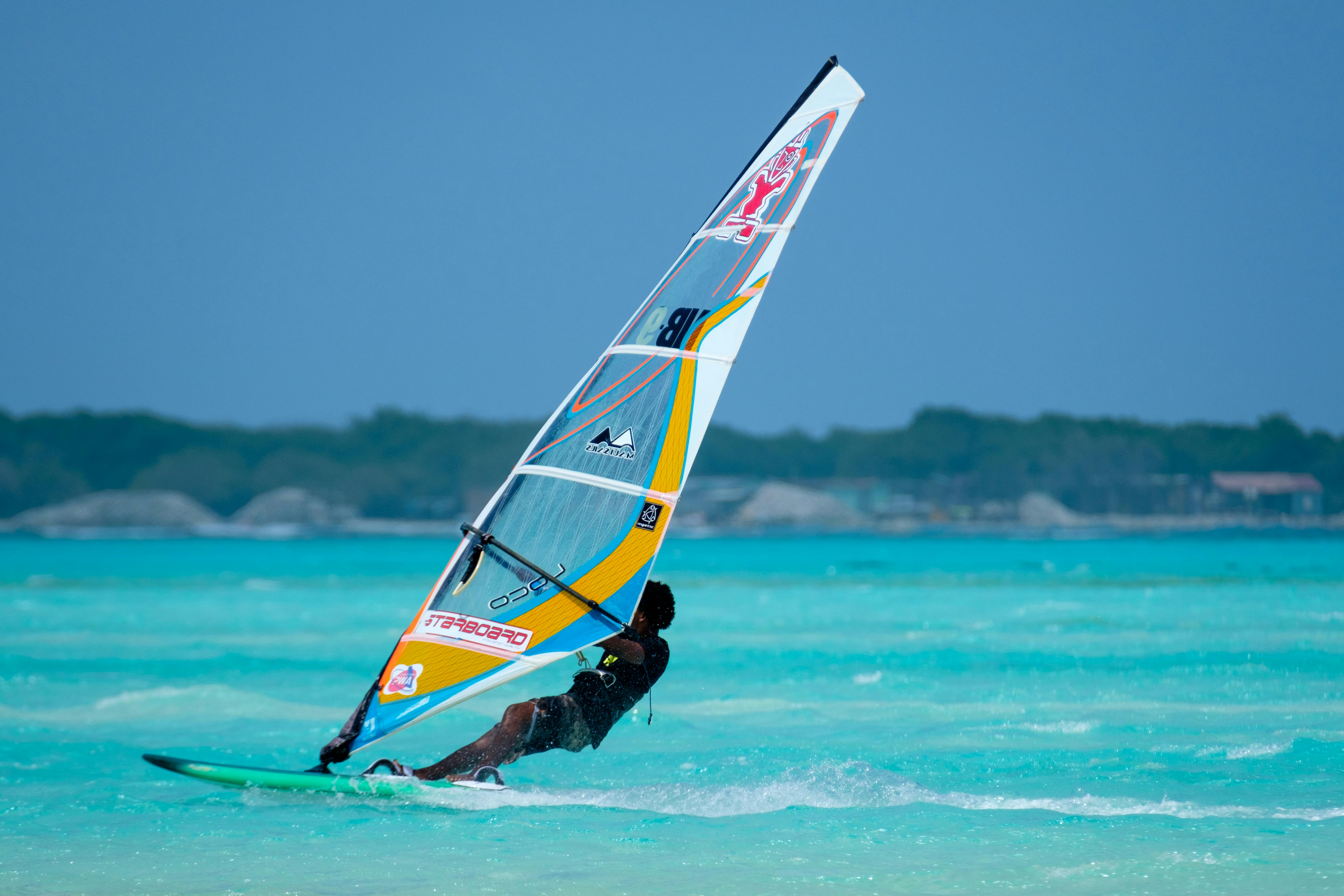 A Windsurfer on a Windsurfing Board · Free Stock Photo