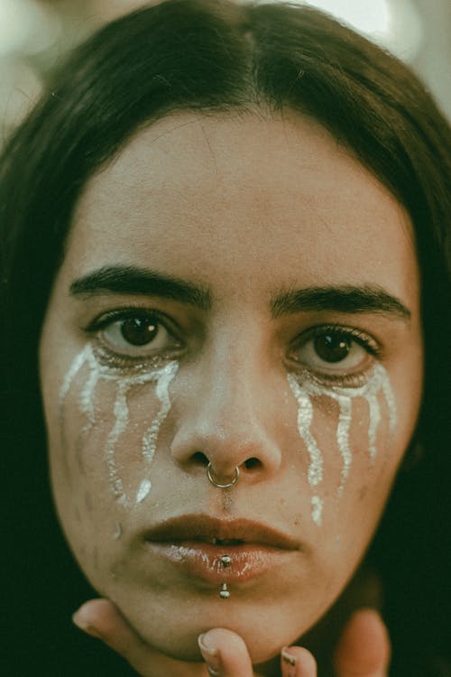 Portrait of Woman with Teardrops Makeup on Face