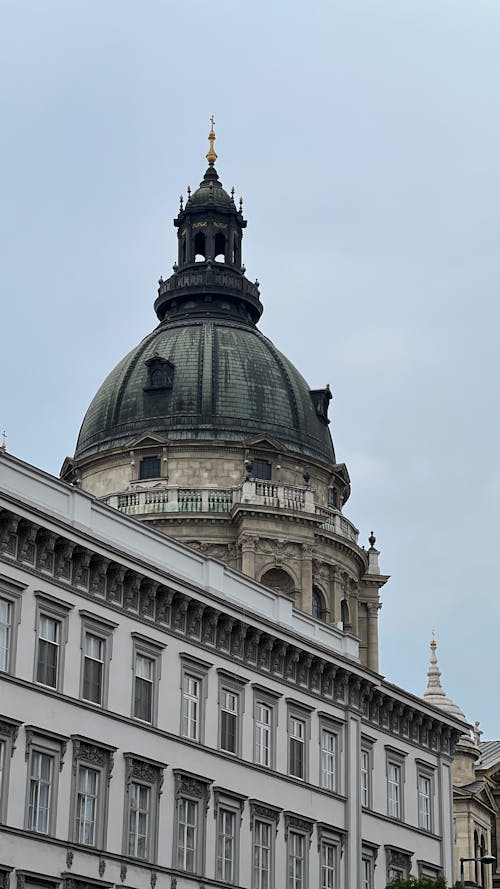 Facade of a Building and the Dome of the St. Stephens Basilica in Budapest, Hungary
