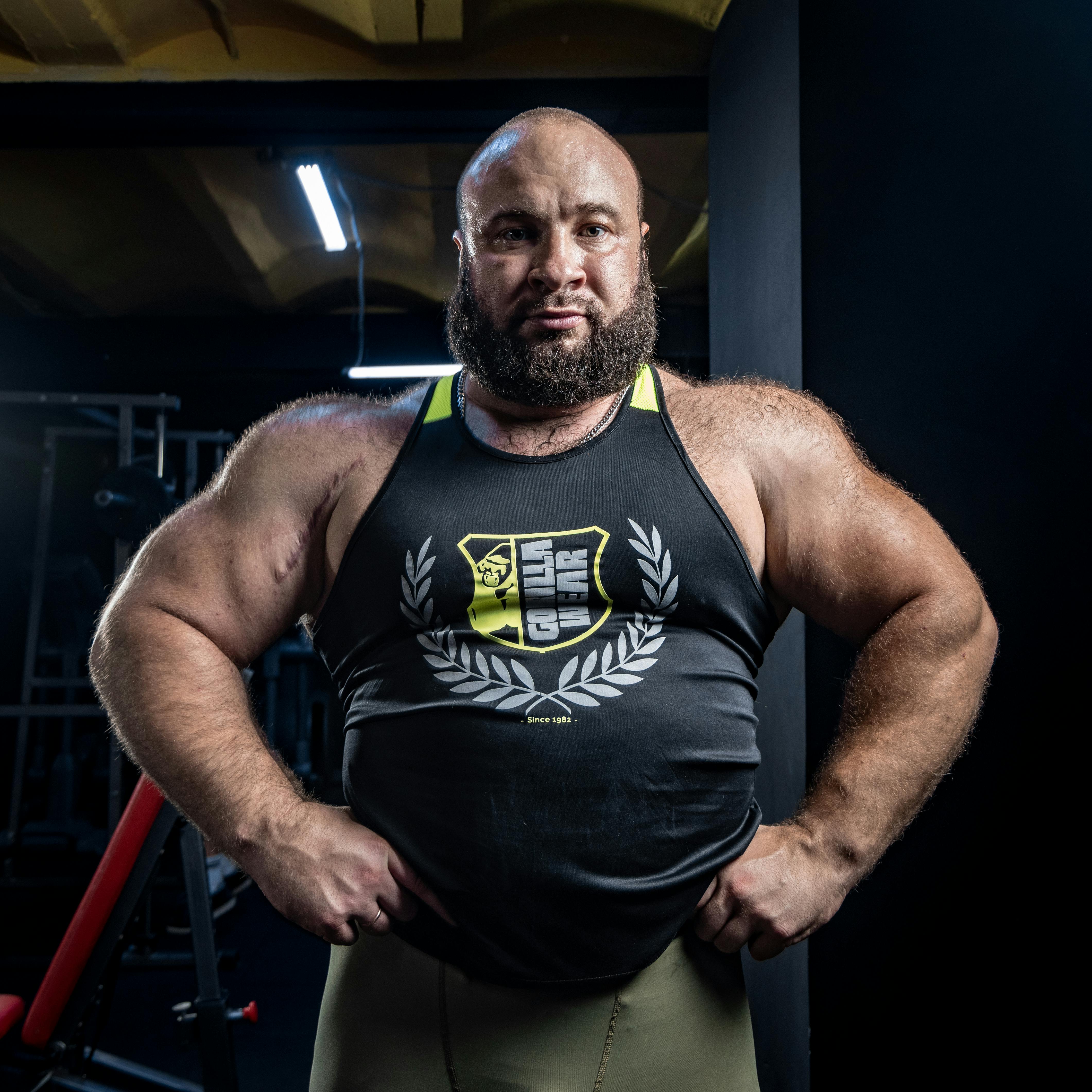 Muscular Bald Man in Tank Top · Free Stock Photo