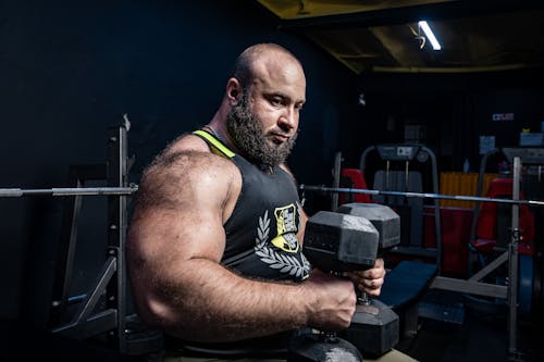 Man Lifting Weights at Gym