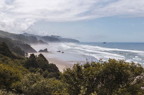 Free Stunning view of Big Sur coast with misty waves and lush greenery on a summer day. Stock Photo
