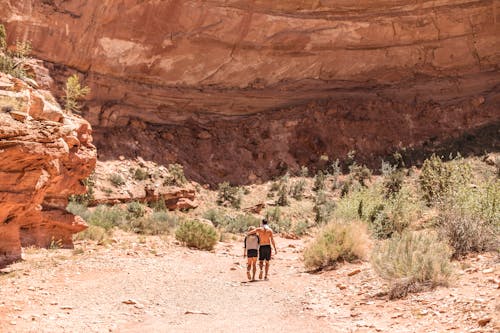 Couple Walking by Rocky Mountain