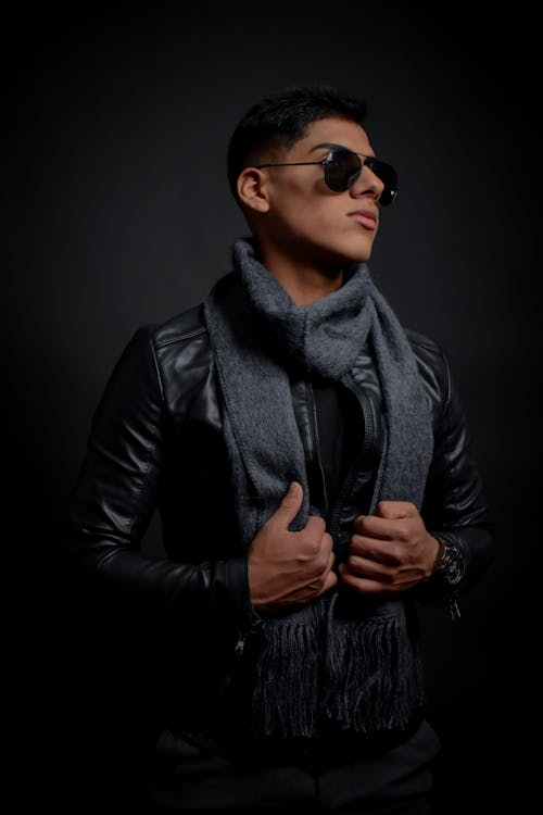 Man Posing in Black Leather Jacket and Aviator Sunglasses