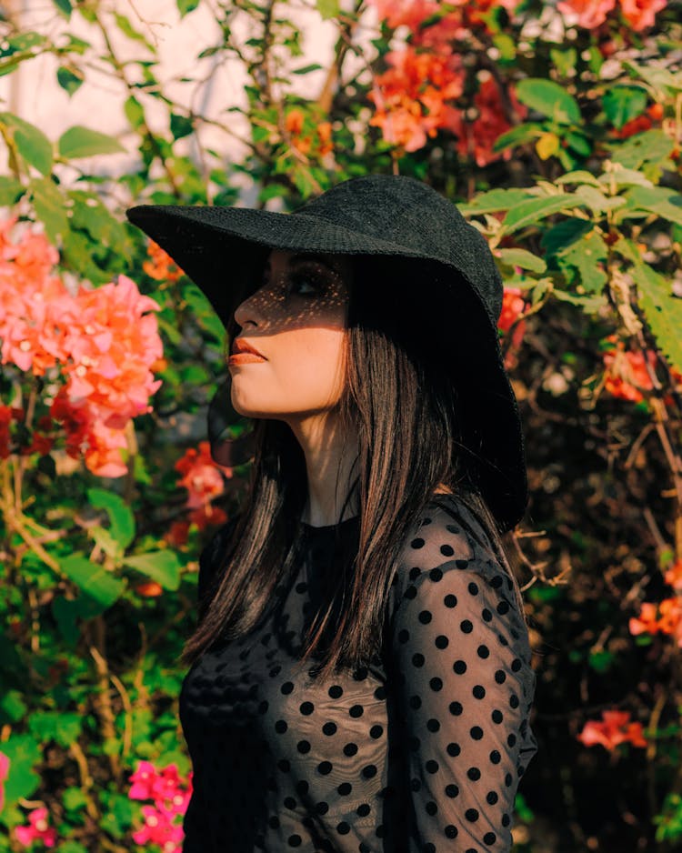 Woman In Black Hat And Transparent Shirt