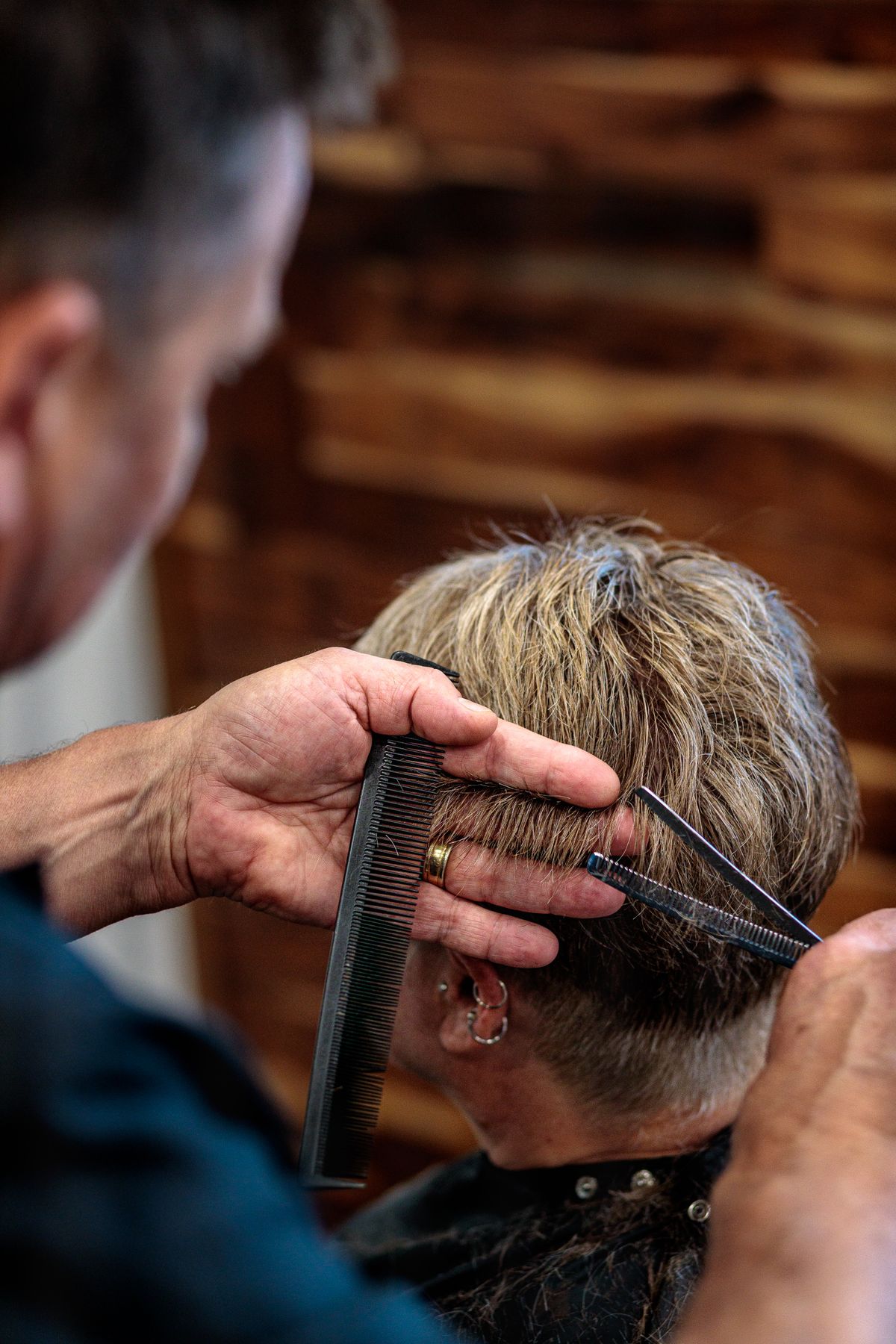 Hairstylist cutting a client's hair