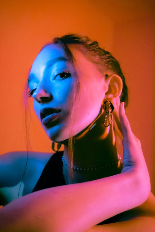 Modern Studio Shot of a Young Woman Posing in Split Lighting 