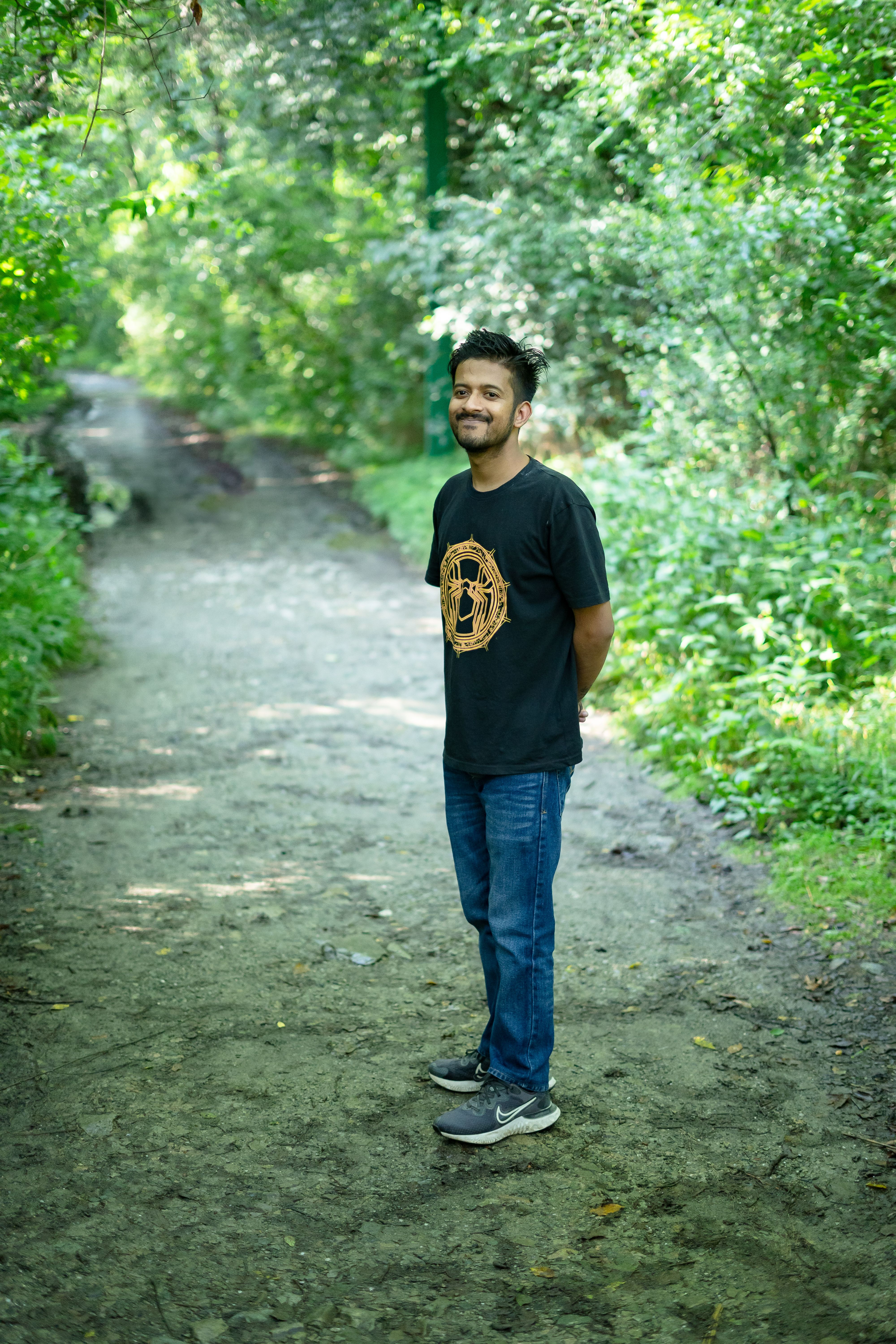 Man Standing on a Path Among Trees · Free Stock Photo