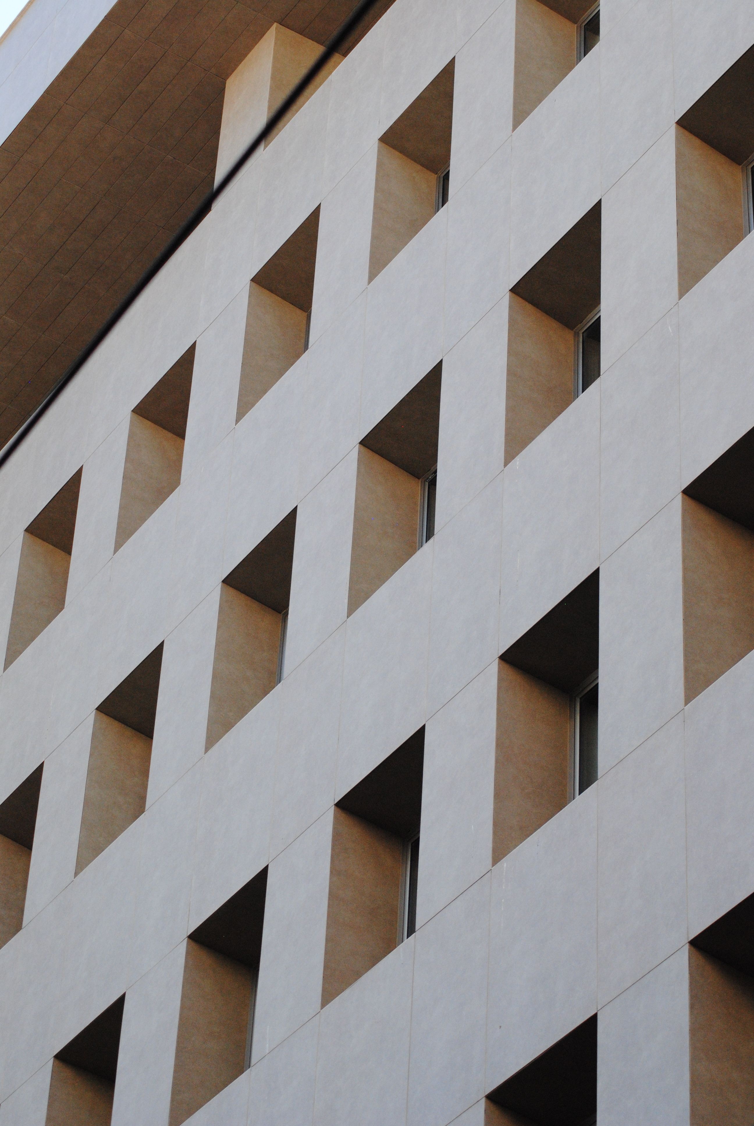 Closeup of a Simple Modern Building with Windows · Free Stock Photo