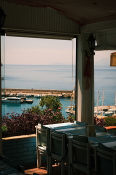 Serene view from a Antalya restaurant overlooking the harbor and coastline.