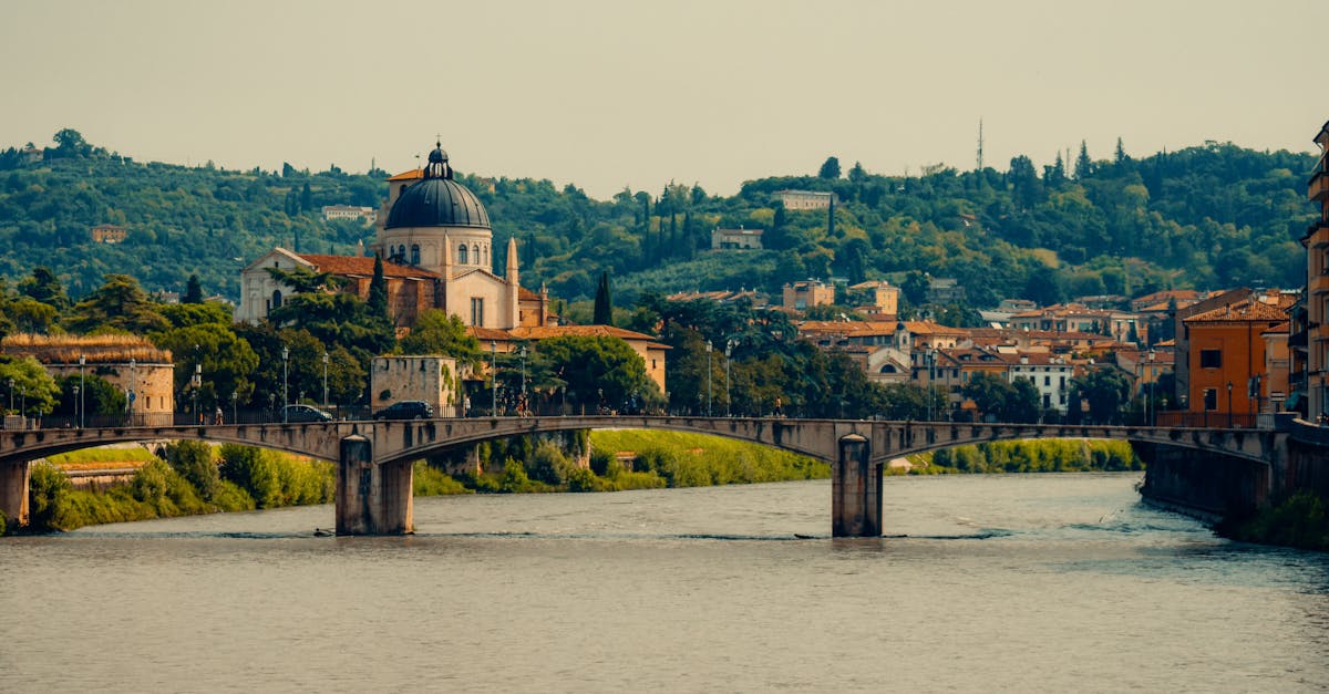 Captivating view of Verona's historic bridge and cathedral, highlighting Italy's architectural charm.