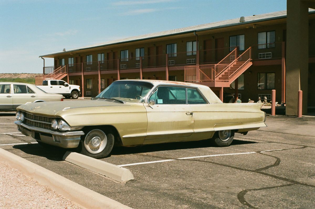 Classic vintage automobile parked in a sunny retro setting