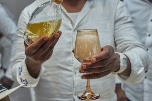 Man Drinking Champagne From a Glass 