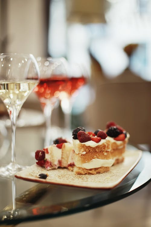 Champagne Flutes and Slices of a Strawberry Cake