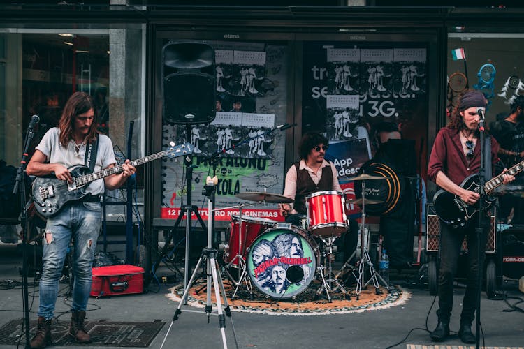 Music Band Performing In Front Of Building