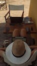 Hat of Person Sitting with Laptop