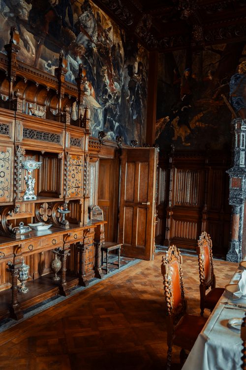 Free Opulent wooden room in a German castle, showcasing intricate furniture and paintings. Stock Photo