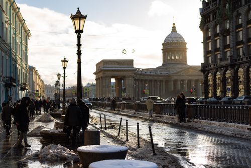 Free A winter scene near Kazan Cathedral with snow and pedestrians on a city street in Saint Petersburg. Stock Photo