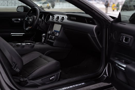 Explore the sleek interior of a Ford Mustang, highlighting the luxurious leather seats and modern dashboard.