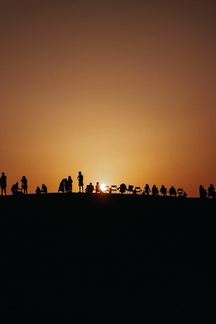 People Silhouette At Sunset Under Clear Sky