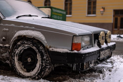 An Old Volvo Covered in Snow and Ice 