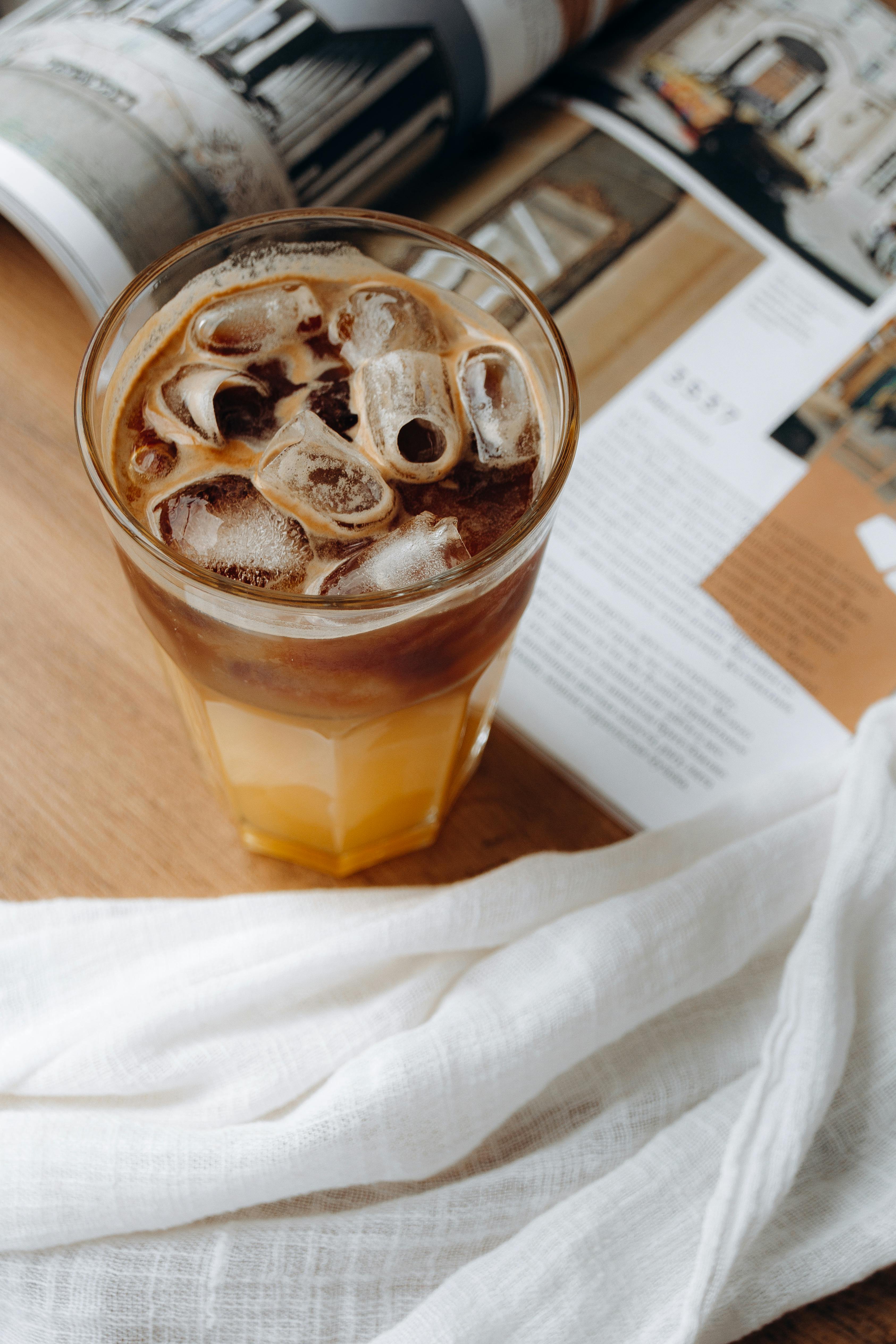 A Glass Jar Of Iced Coffee On The Table Stock Photo, Picture and Royalty  Free Image. Image 93747087.