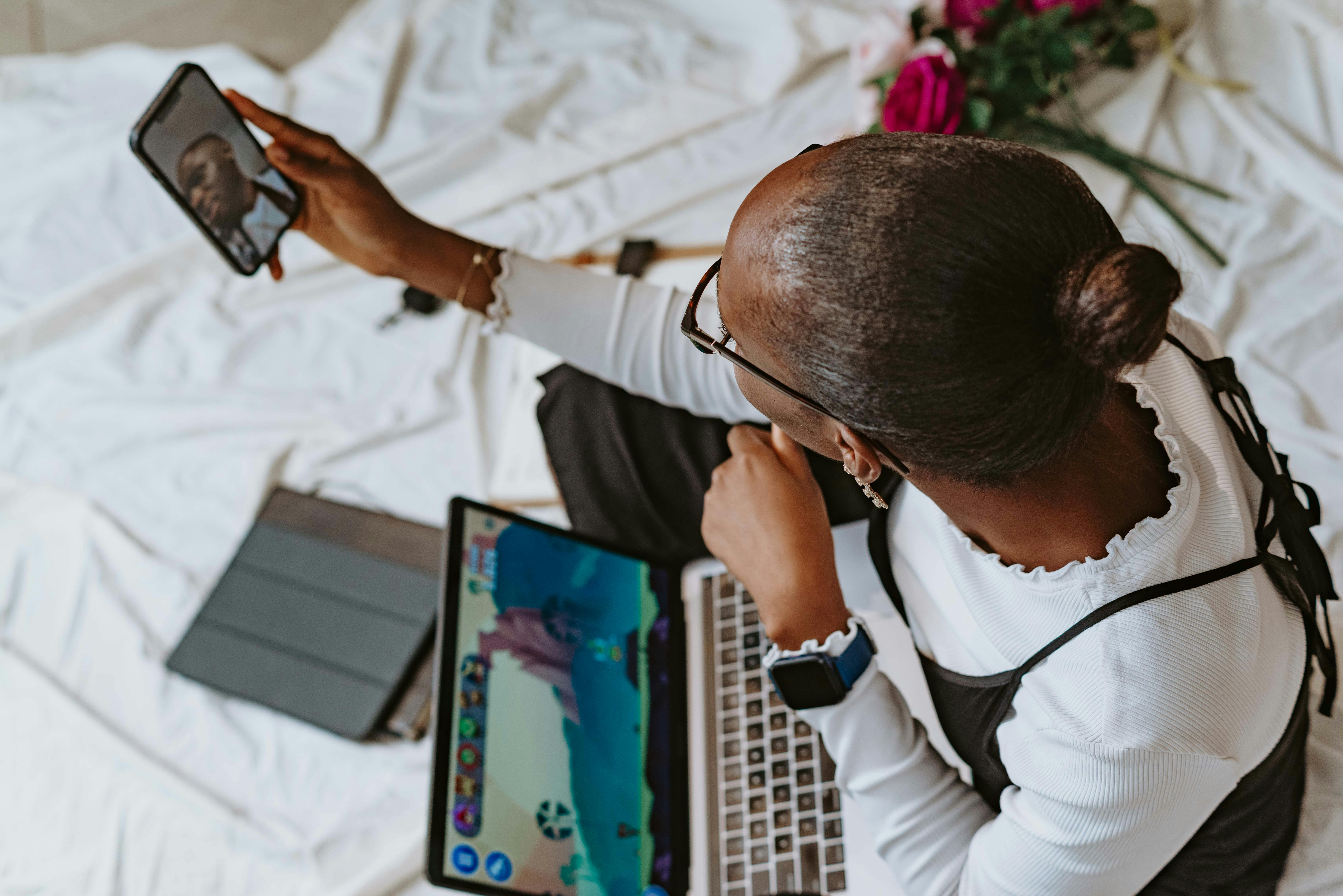 woman working with laptop and smartphone