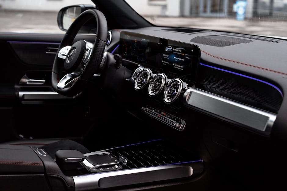 Ultimate Smart Climate Control Comparison: Thermostats, Fans & Air Quality (2026) Sleek interior of a luxury car featuring a digital display, steering wheel, and futuristic controls.