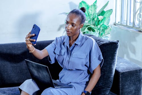 Woman on Sofa Making Selfie