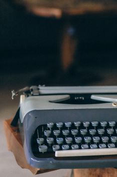 A close-up of a vintage typewriter highlighting its retro design and classic keys.