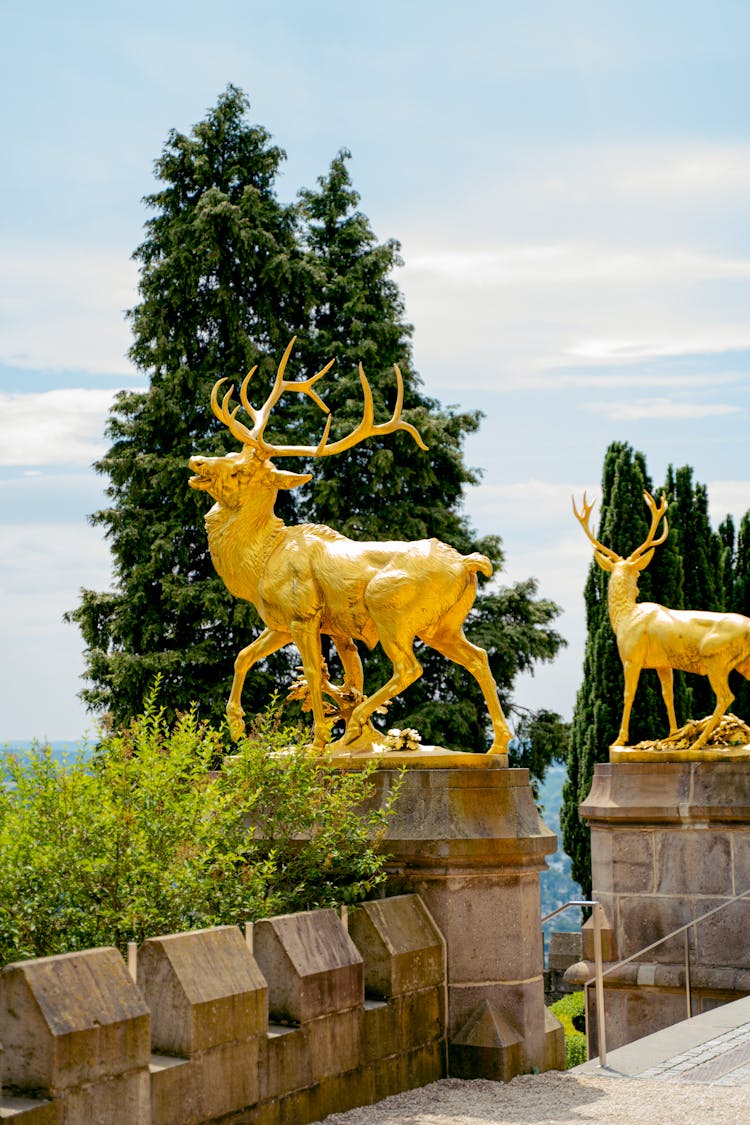 Golden Reindeer Statues In Park