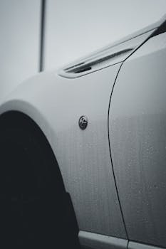 A sleek, modern car exterior in a close-up view emphasizing design details.