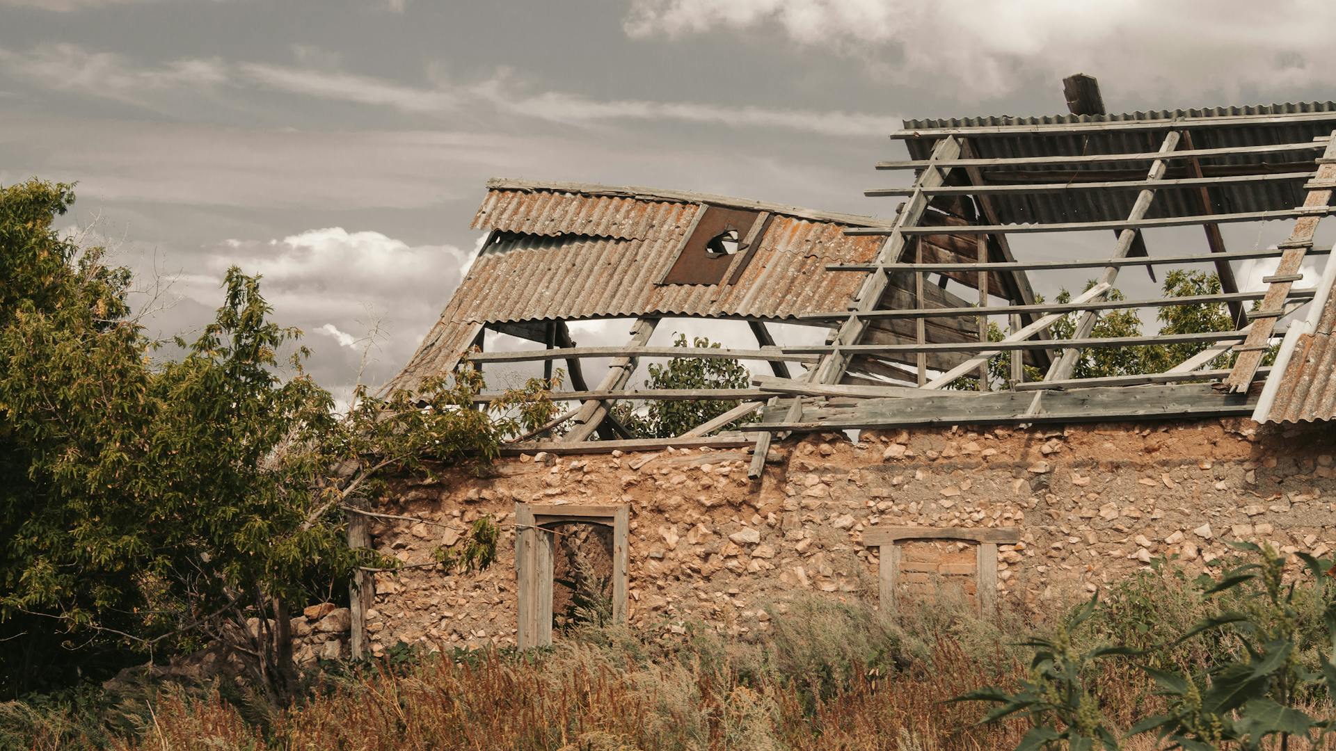 Abandoned Rural Stone House with Collapsed Roof