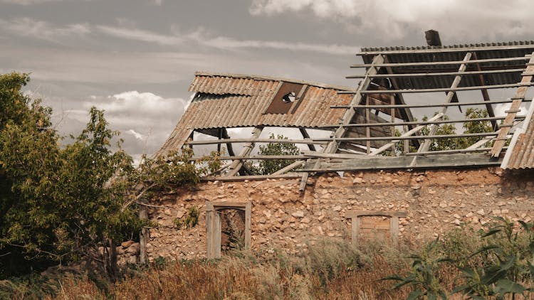 Abandoned Rural Stone House With Collapsed Roof