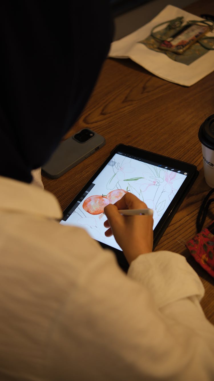 Woman Drawing On Tablet