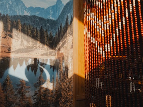 Sunlit interior featuring a beaded curtain and a nature mural wall, creating a warm ambiance.