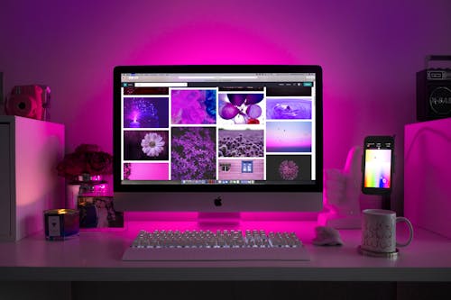 Free Silver Imac Displaying Collage Photos Stock Photo