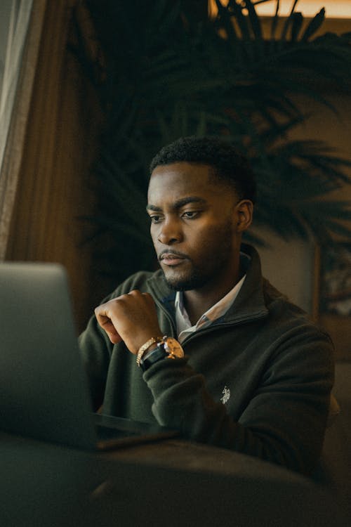 Portrait of Man Working on Laptop