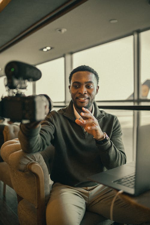 Man Sitting near Windows