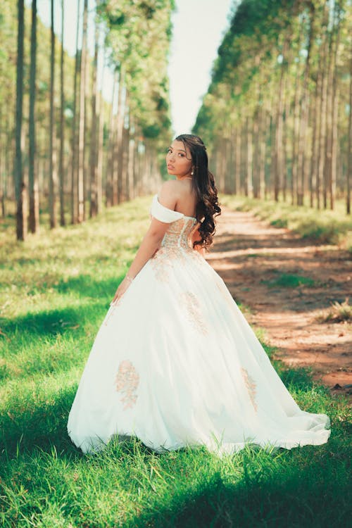 Bride in Wedding Dress Posing in Forest