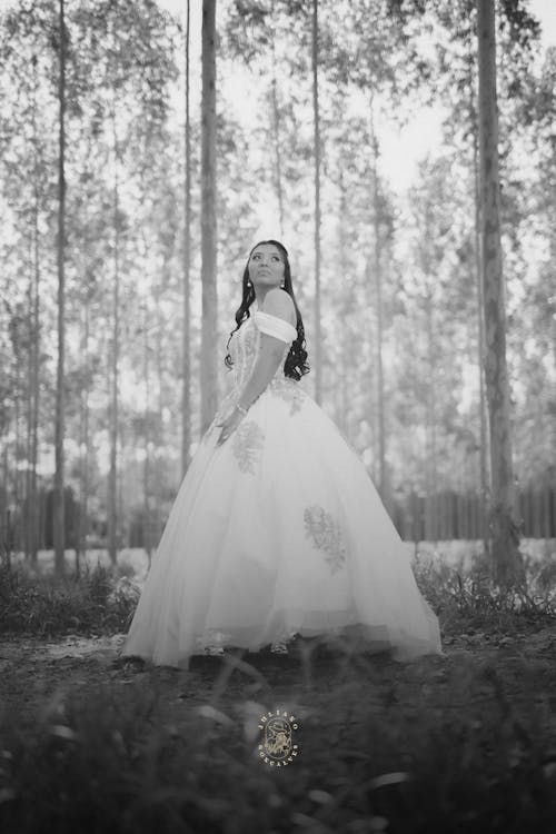 Bride in Wedding Dress in Forest