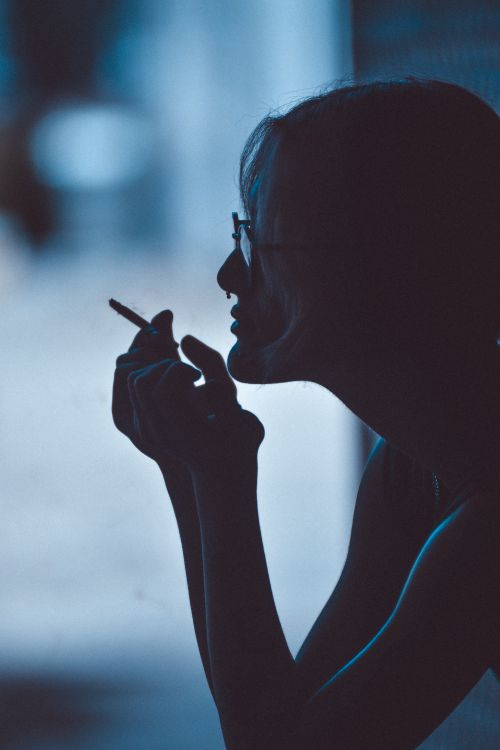 Free Moody silhouette of a person smoking in Antalya, capturing a moment of contemplation. Stock Photo