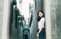 Woman Leaning On Wall