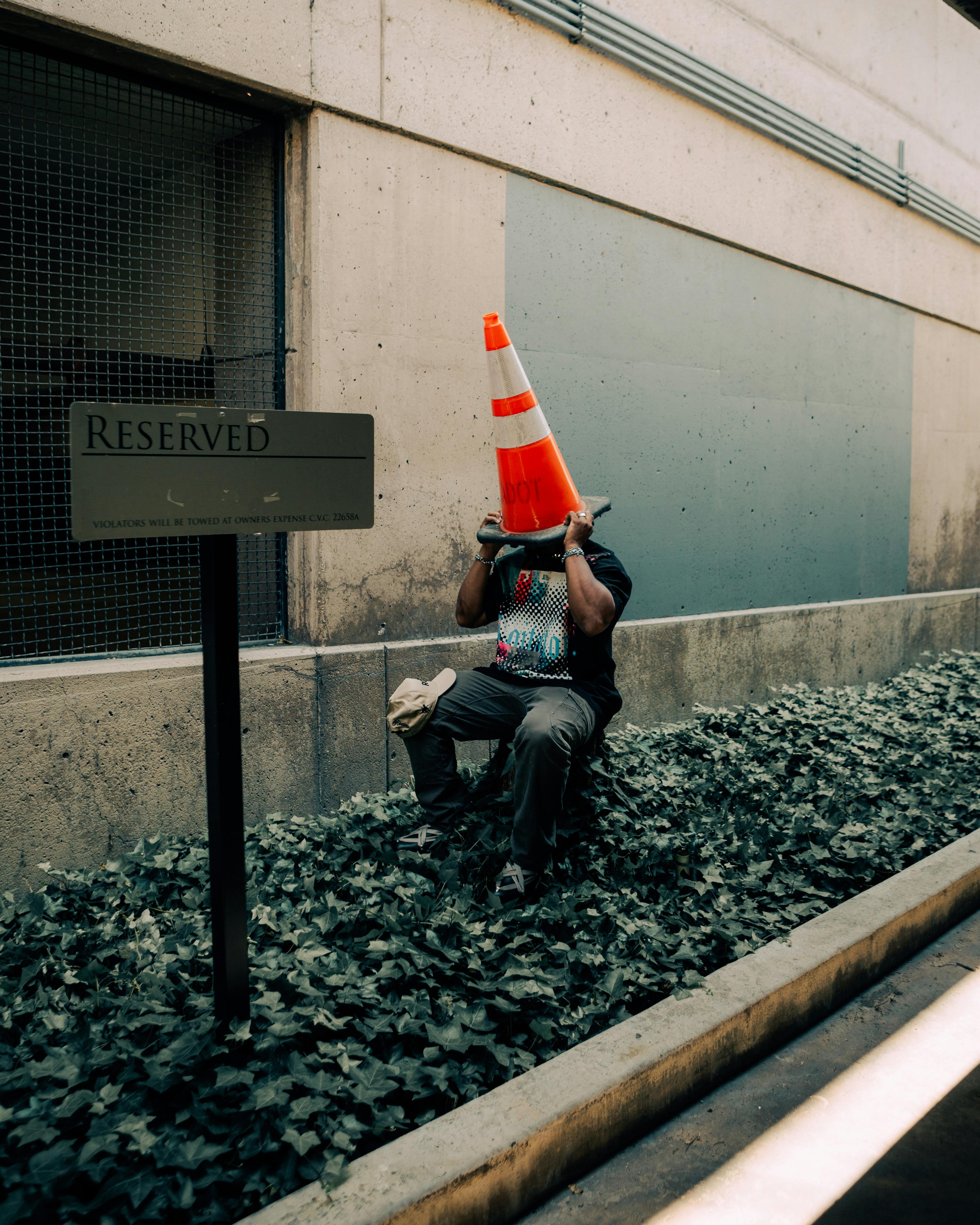 Man Putting Traffic Cone on Head · Free Stock Photo