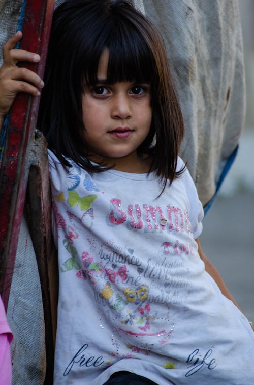 Portrait of a Little Girl on a Street